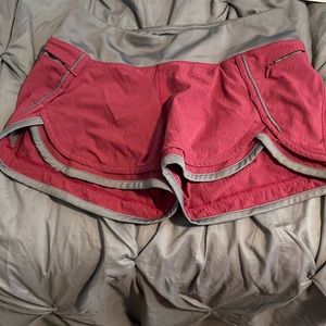 Hylete running shorts maroon & gray. Built in liner and two zippered pockets.